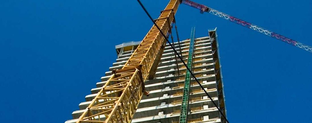 Crane on a building site, covered by construction insurance
